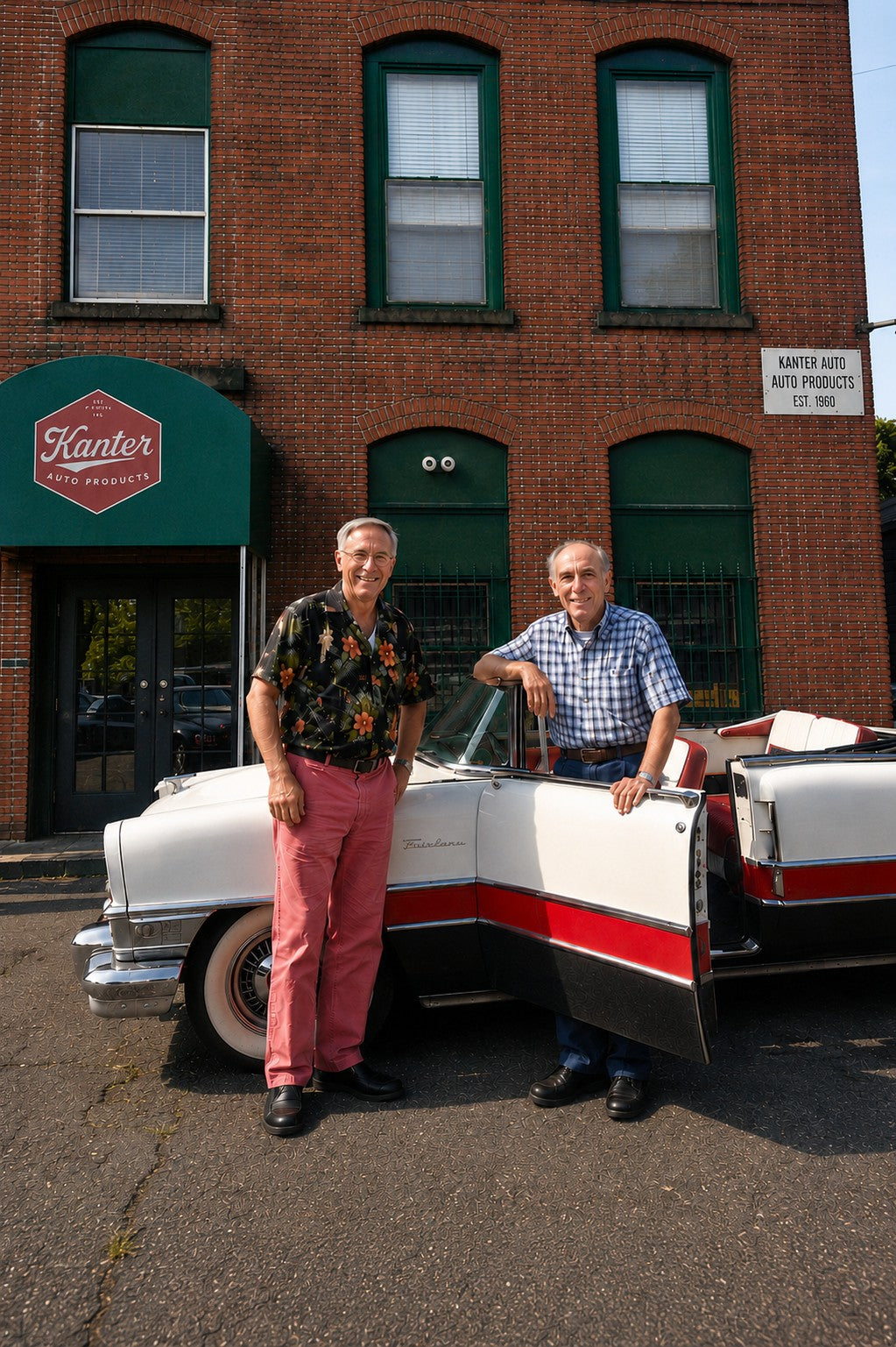 Fred and Dan Kanter with a classic convertible in front of the Kanter Auto Products building